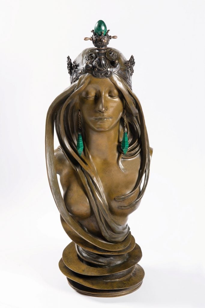 A sculpture showing a woman's face and her torso