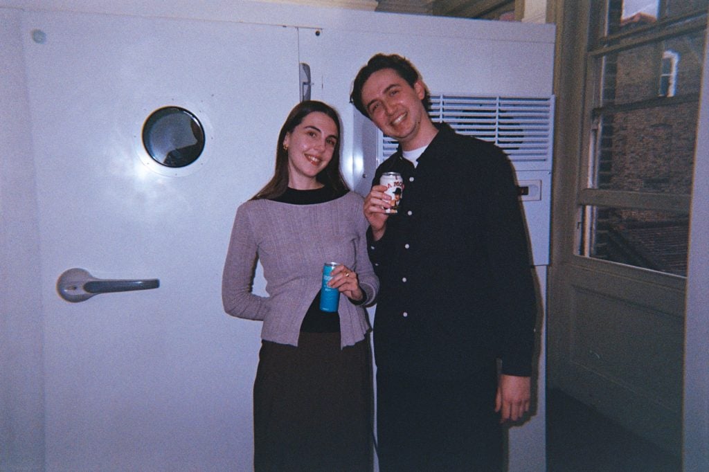 photo of man and woman holding beer