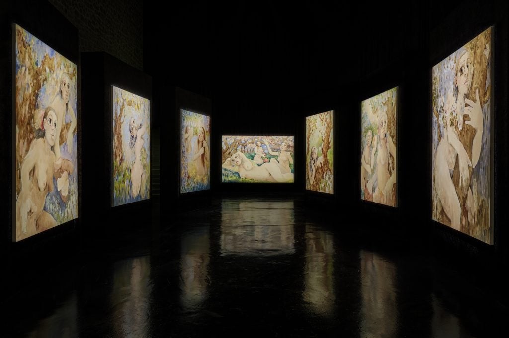 Fundación La Nave Salinas installation view of large-scale figurative abstract paintings illuminated and reflecting on the black glossy ground.